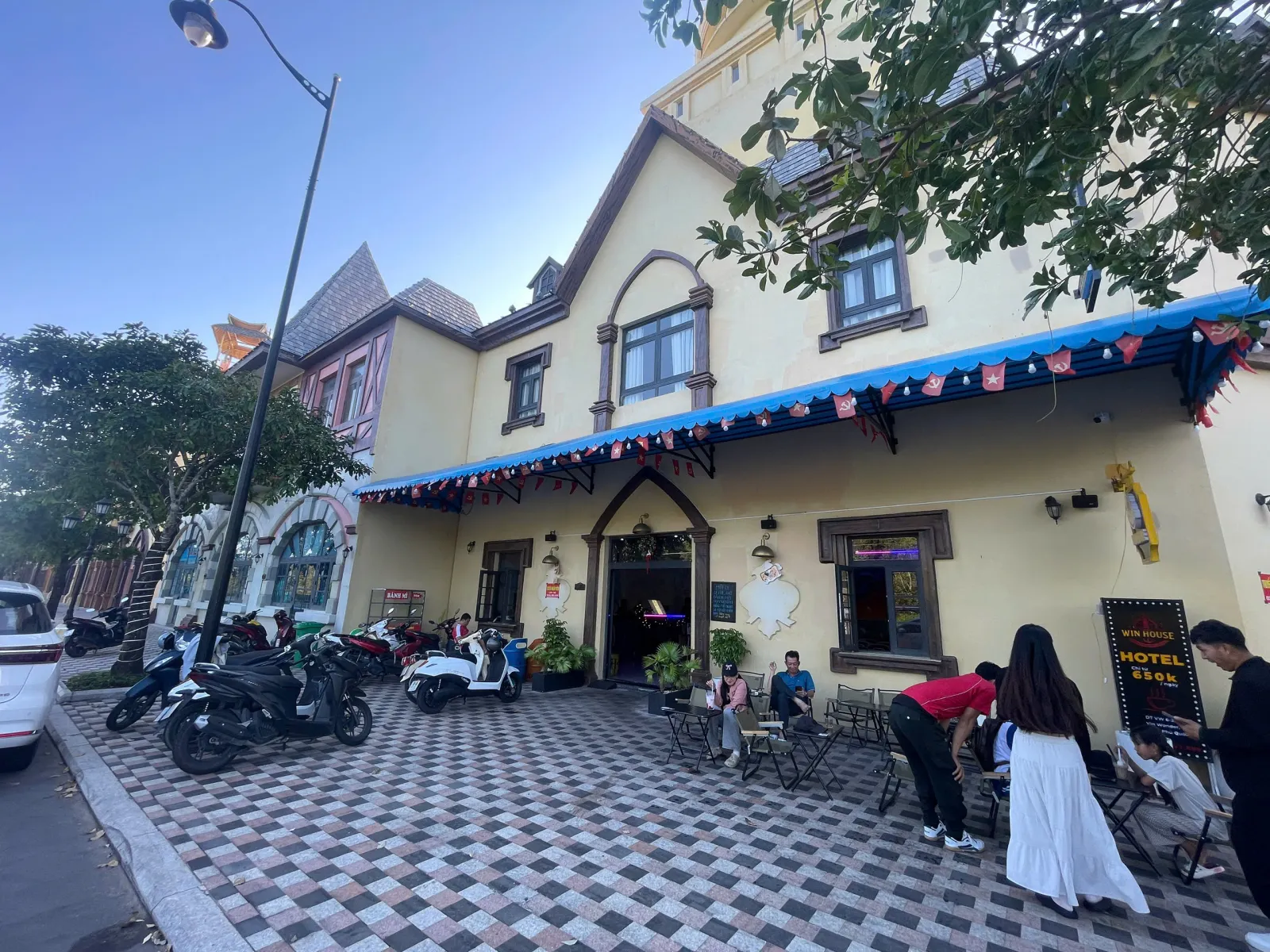 Win House front with guests